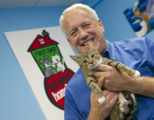 man holds cat